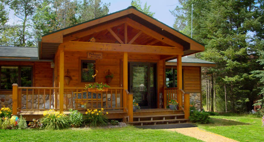 Front porch entry way, deck, siding and design by Thompson Construction